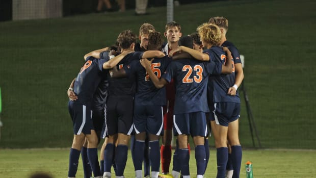 The Virginia men's soccer team huddles during its match against Xavier at Klockner Stadium.